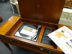 A mid-century Dynatron Garrard gramophone in a reproduction mahogany effect case Condition reports