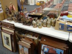 A very large collection of John Wayne merchandise including collectors plates, figurines, 'Stars &