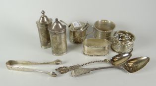 Group of assorted silver items to include napkin rings, various condiments, sugar tongs ETC