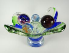 An art-glass centre dish and five twentieth century glass paperweights including Wedgwood