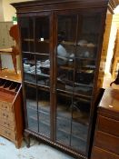 A good standing mahogany two-door glazed bookcase, 191cms h x 92cms l x 34cms d Condition reports