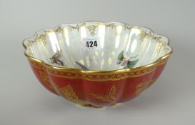 A Wedgwood Fairyland-style lustre bowl of fluted form, the exterior in oxblood-red reserve with
