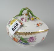 A Meissen porcelain teardrop shaped bowl and lid decorated all round with sprays of flowers with