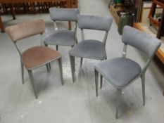 A set of four Ernest Race cast aluminum chairs, model number BA23 with upholstered rails and seats