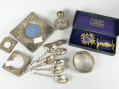 A parcel of silver including spoons, scent bottle, picture frames etc together with a cased silver-