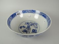 A nineteenth century Chinese porcelain footed circular bowl, the exterior decorated with Prunus, the