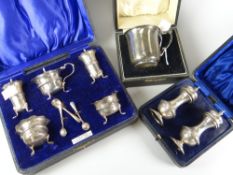 Three cased silver items comprising plain-body mug with decorative handle, 2.3ozs, a pair of salt