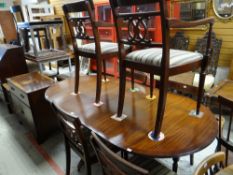 A reproduction twin-pedestal dining table and six chairs together with a vintage bureau and a carved