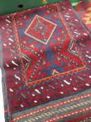 A blue and red Meshwani runner, 265 x 59cms Condition reports provided on request by email for
