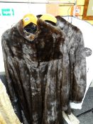 A South African dark fur long coat and another Condition reports provided on request by email for
