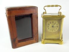 A good vintage brass carriage clock with gilt metal face and dial bearing Arabic numerals,