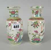 A pair of Famille Rose baluster vases, enamel decorated with flora and fauna, 15cms high Condition