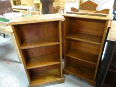 A pair of vintage light oak three-shelf open bookcases with architectural finials, 106cms h x
