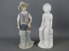Spode figurine by Pauline Shaw titled 'Michael' and a Lladro figurine of a young boy with fishing