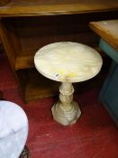 Carved alabaster circular top pedestal table
