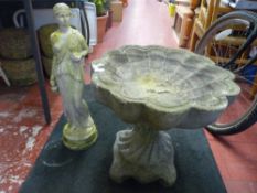 Reconstituted stone maiden garden ornament and a shell shaped bird bath on plinth