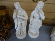 Pair of parian ware figures of a young man and woman