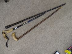 African carved hardwood cane, a modern Leki extending walking stick and one other
