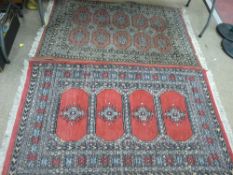 Two colourful antique style rugs, 150 x 92 cms and 160 x 95 cms