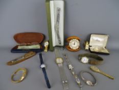 Collection of lady's and gent's wristwatches, a cased travel alarm clock, a bronze desk model of a