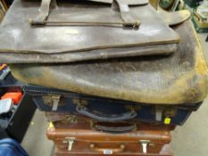 Three vintage suitcases and two attache cases