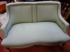 Well presented antique style two seater couch on turned supports