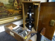 R G J Beck Ltd, London japanned microscope, model 29 no. 11542 with additional lenses in an oak