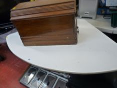 Retro style corner table on metal supports and a cased manual Singer sewing machine