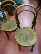 Pair of bentwood chairs with floral design to seat