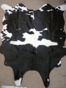 Black and white cow hide skin