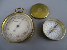 Vintage brass compensated pocket barometer and a brass cased pocket compass