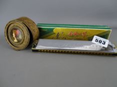 Probably French gilt brass and enamel effect top box and a Hero harmonica in box