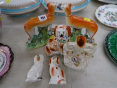 Pair of Staffs greyhound figurines, two seated spaniels with flower baskets and one other with a