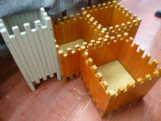 Three wooden matching garden planters and another similar