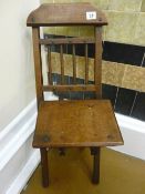 Small folding polished wood chair