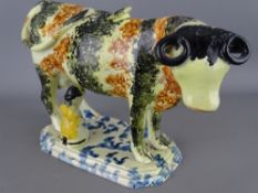 Early spongeware decorated cow creamer with seated milkmaid (restorations)