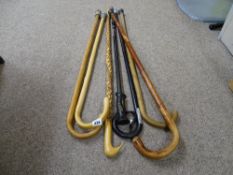 Group of vintage and other walking sticks and canes
