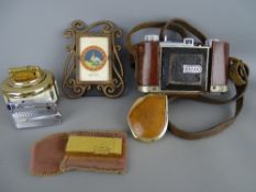 Leather cased Kodak vintage camera, four vintage lighters and a modern portrait frame containing a
