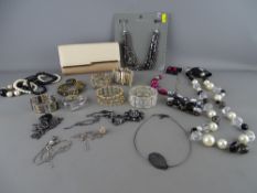 Quantity of fancy costume jewellery and a stylish lady's evening purse