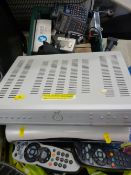 Tub containing digital cameras, Tesco mobile phone, two Sky boxes and bag of various electric cables