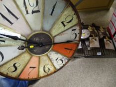 Two wirework wall clocks and a vintage style roulette wheel wall clock