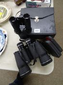 Cased pair of Halina 20x50 binoculars and a pocket pair of Helios field glasses