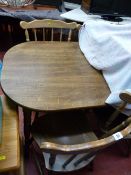 Polished wood dining table and four spindleback chairs