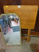 Ornate bevelled edge mirror and a folding wooden side table
