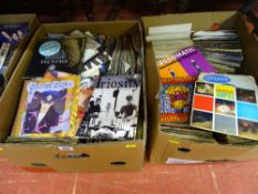 Two boxes of 45rpm records, artists include Bob Marley, Boomtown Rats, Kim Wilde, Spandau Ballet,