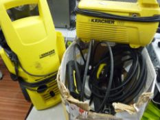 Two Karcher power washers with accessories E/T