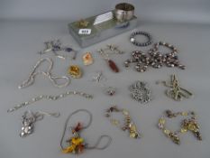 Collection of silver and other jewellery and a white metal chased decorated bangle in an Art Deco