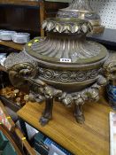 Classically styled composition gilt decorated planter with ram's mask and floral swag detail on