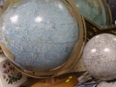 Vintage style desk globe and a tinplate globe of the moon with manned landing sites indicated