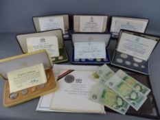 Seven boxed proof sets by Franklin Mint, eight vintage British one pound notes and a 2003 Coronation